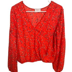 Red blouse with tiny blue flowers